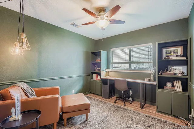a living room with furniture and a window