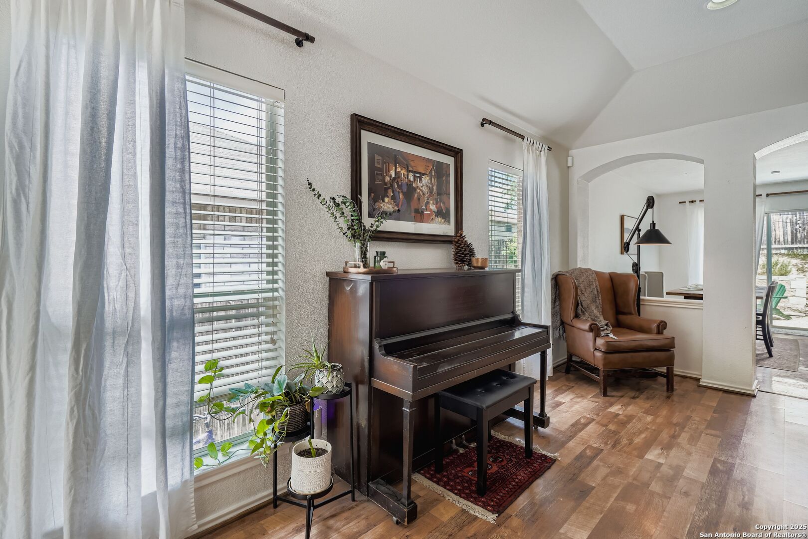 15406 Spring Dew San Antonio, TX 78247 - Photo 6 of 26 a living room with furniture a piano and a window