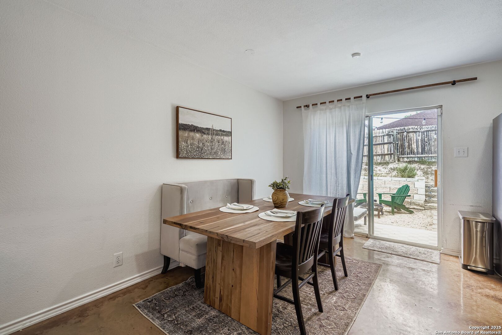 15406 Spring Dew San Antonio, TX 78247 - Photo 7 of 26 a view of a dining room with furniture and a window