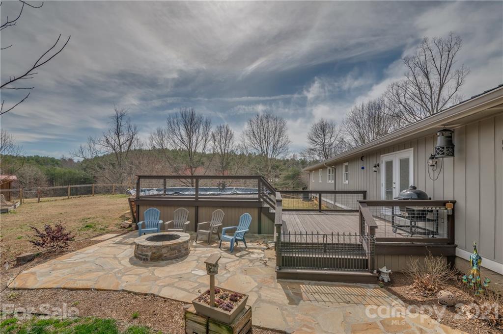 50 Owl Hollow Road Mill Spring, NC 28756 - Photo 11 of 45 a balcony with furniture and a potted plant