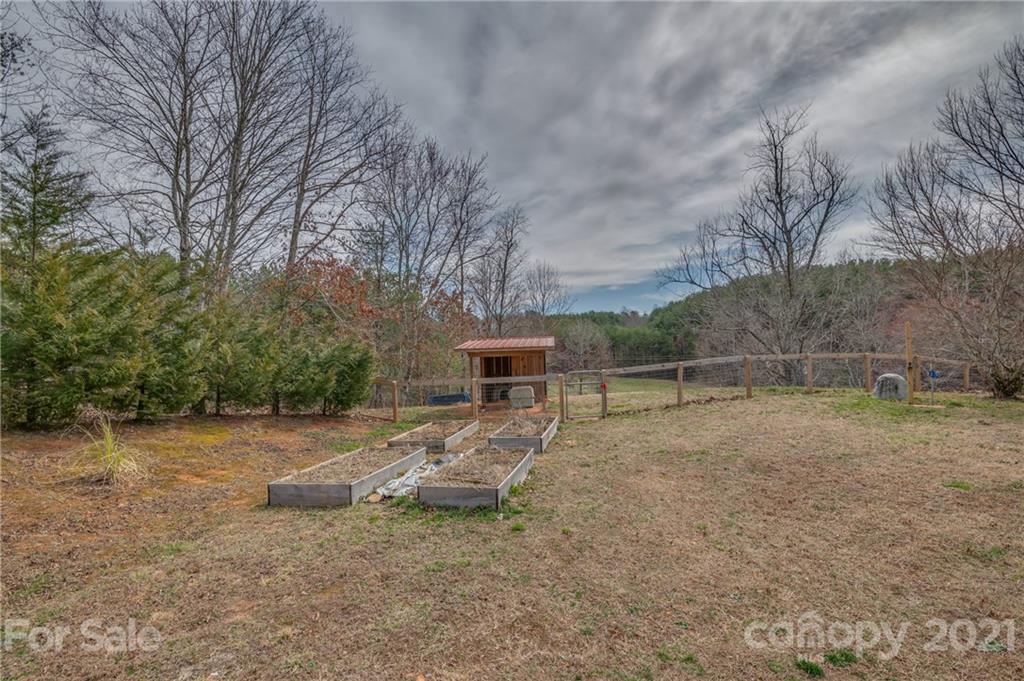 50 Owl Hollow Road Mill Spring, NC 28756 - Photo 24 of 45 a view of backyard with trampoline