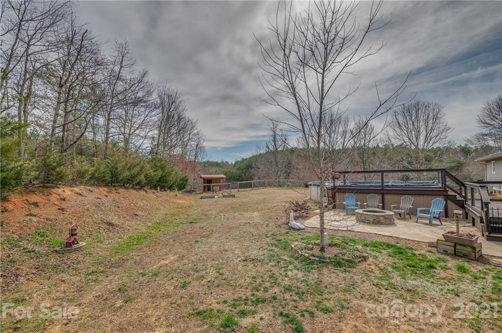 50 Owl Hollow Road Mill Spring, NC 28756 - Photo 27 of 45 a view of backyard with wooden fence