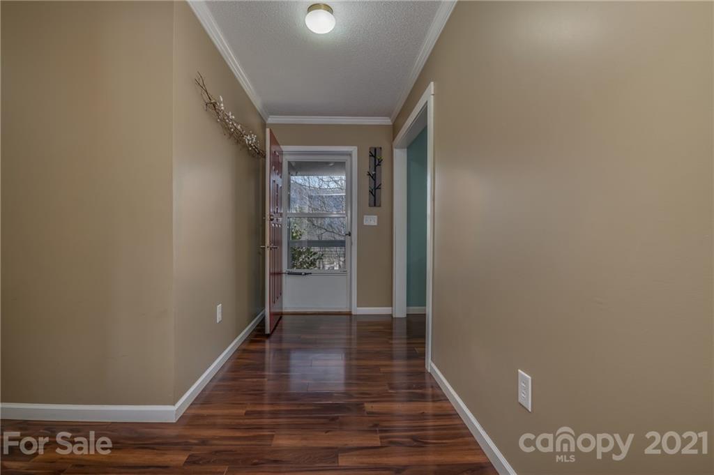 50 Owl Hollow Road Mill Spring, NC 28756 - Photo 40 of 45 a view of a hallway with wooden floor