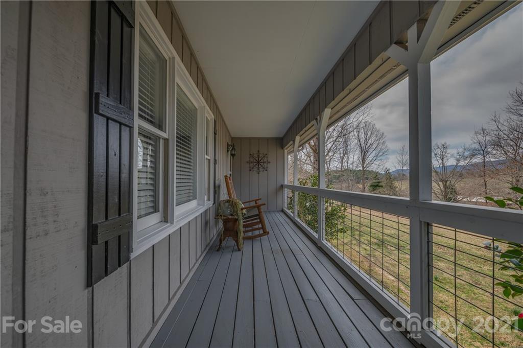 50 Owl Hollow Road Mill Spring, NC 28756 - Photo 5 of 45 a view of balcony with couch