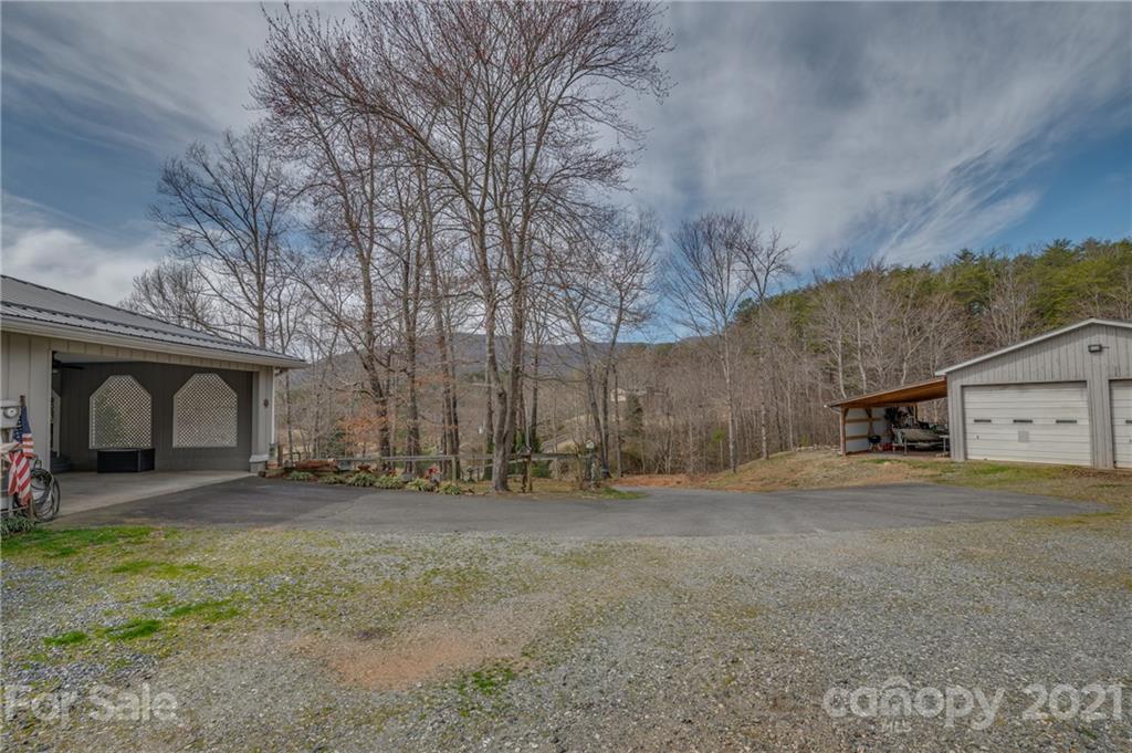50 Owl Hollow Road Mill Spring, NC 28756 - Photo 6 of 45 a large house with a outdoor space