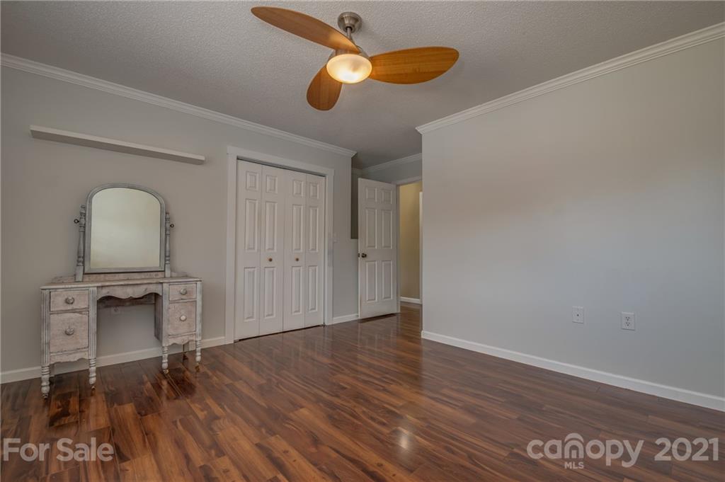50 Owl Hollow Road Mill Spring, NC 28756 - Photo 9 of 45 a view of empty room with wooden floor