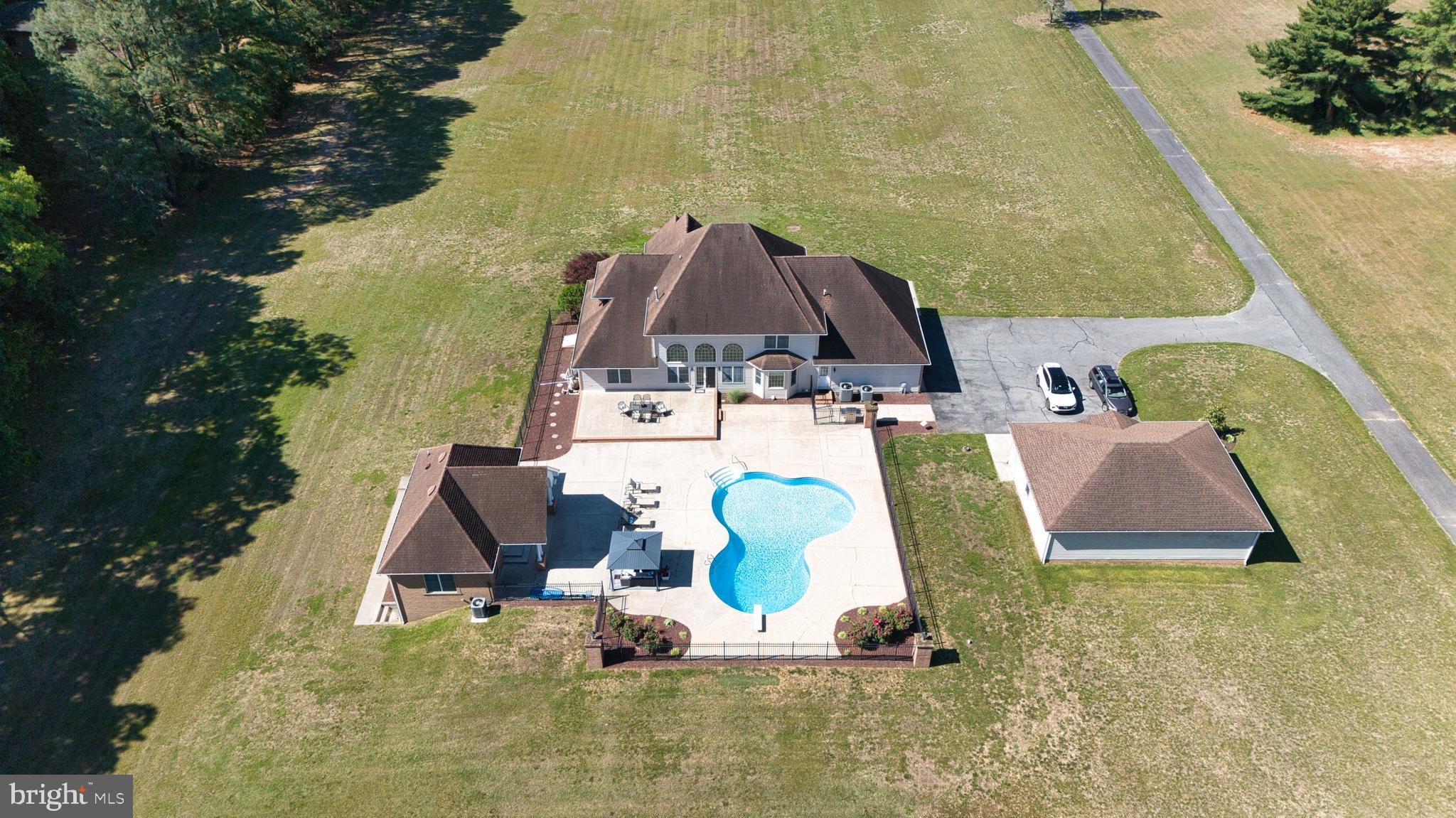 3298 Canterbury Road Milford, DE 19963 - Photo 69 of 74 Aerial View of House, Pool, and Grounds