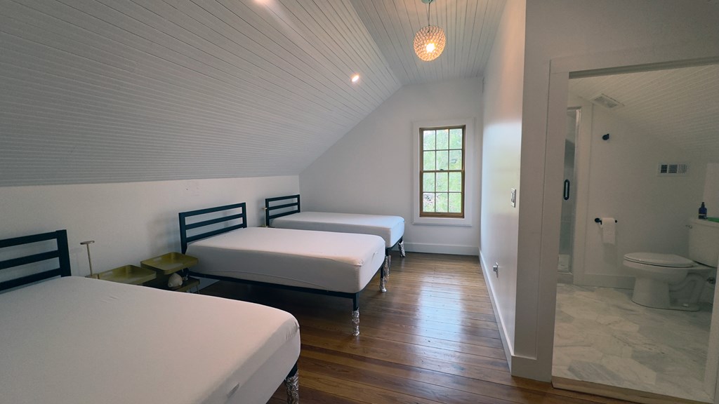 3610 Welgehausen Road Fredericksburg, TX 78624 - Photo 12 of 43 a bedroom with a bed and a lamp