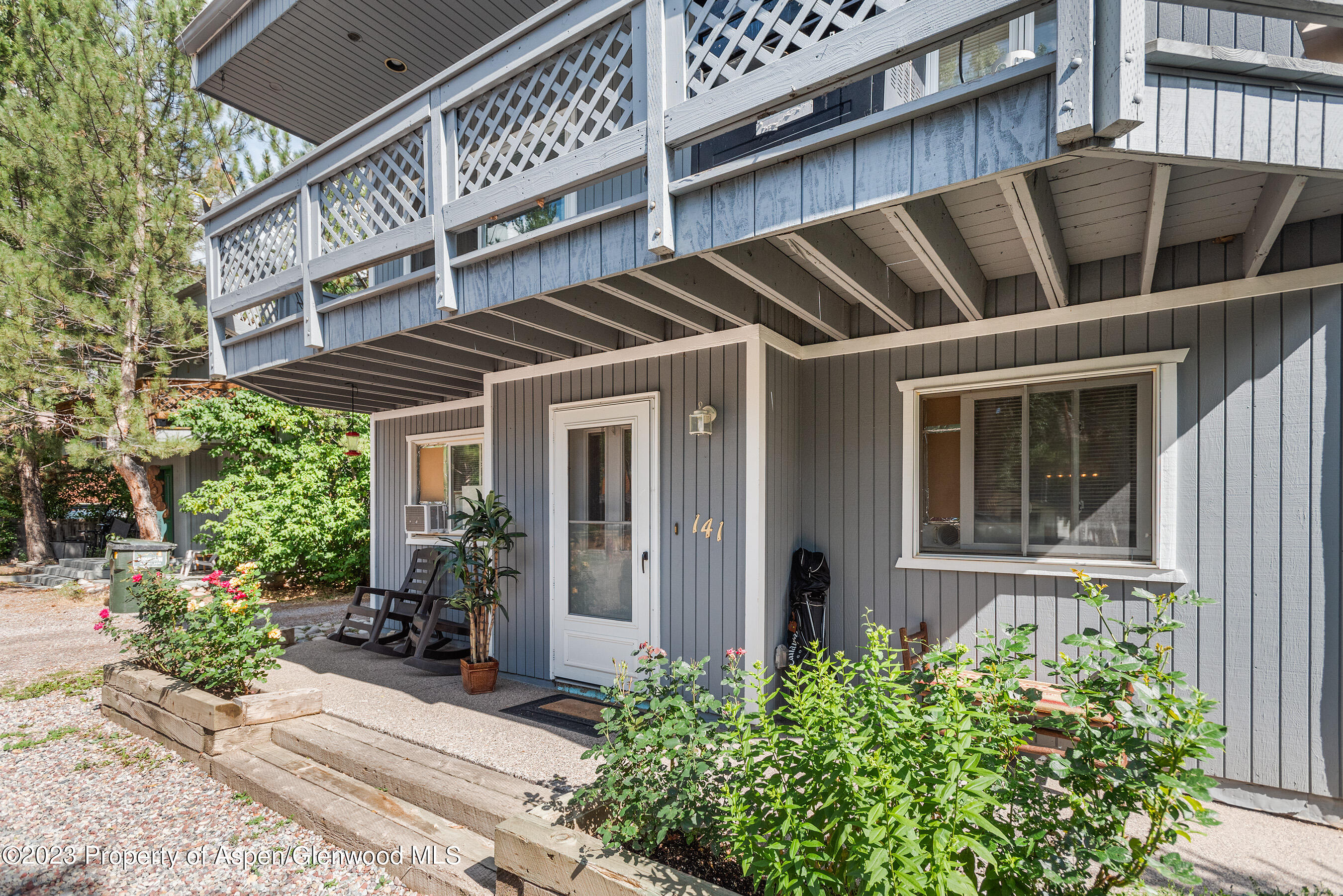 a view of a house with a window and sitting area