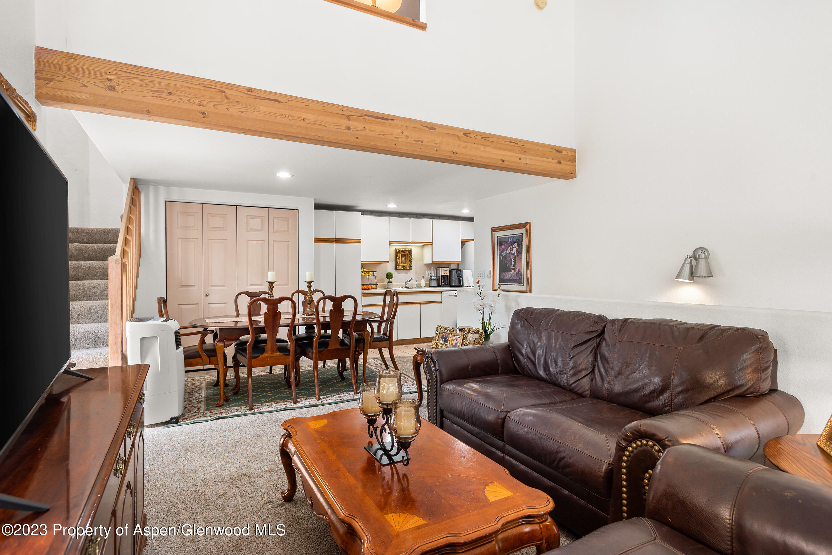 141-143 Swinging Bridge Lane Basalt, CO 81621 - Photo 35 of 35 a living room with furniture a dining table and a flat screen tv