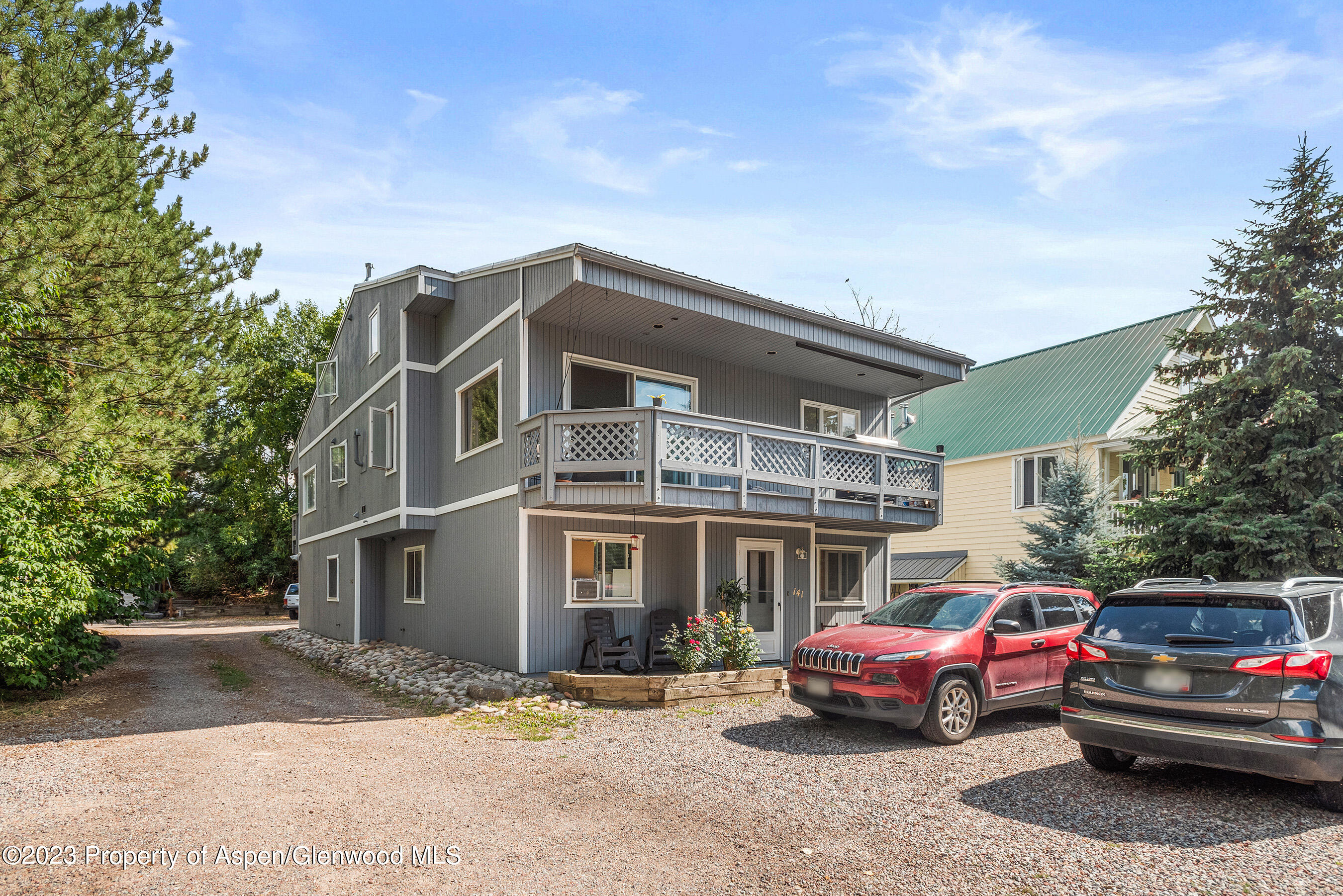 141-143 Swinging Bridge Lane Basalt, CO 81621 - Photo 2 of 35 a front view of a house with a yard