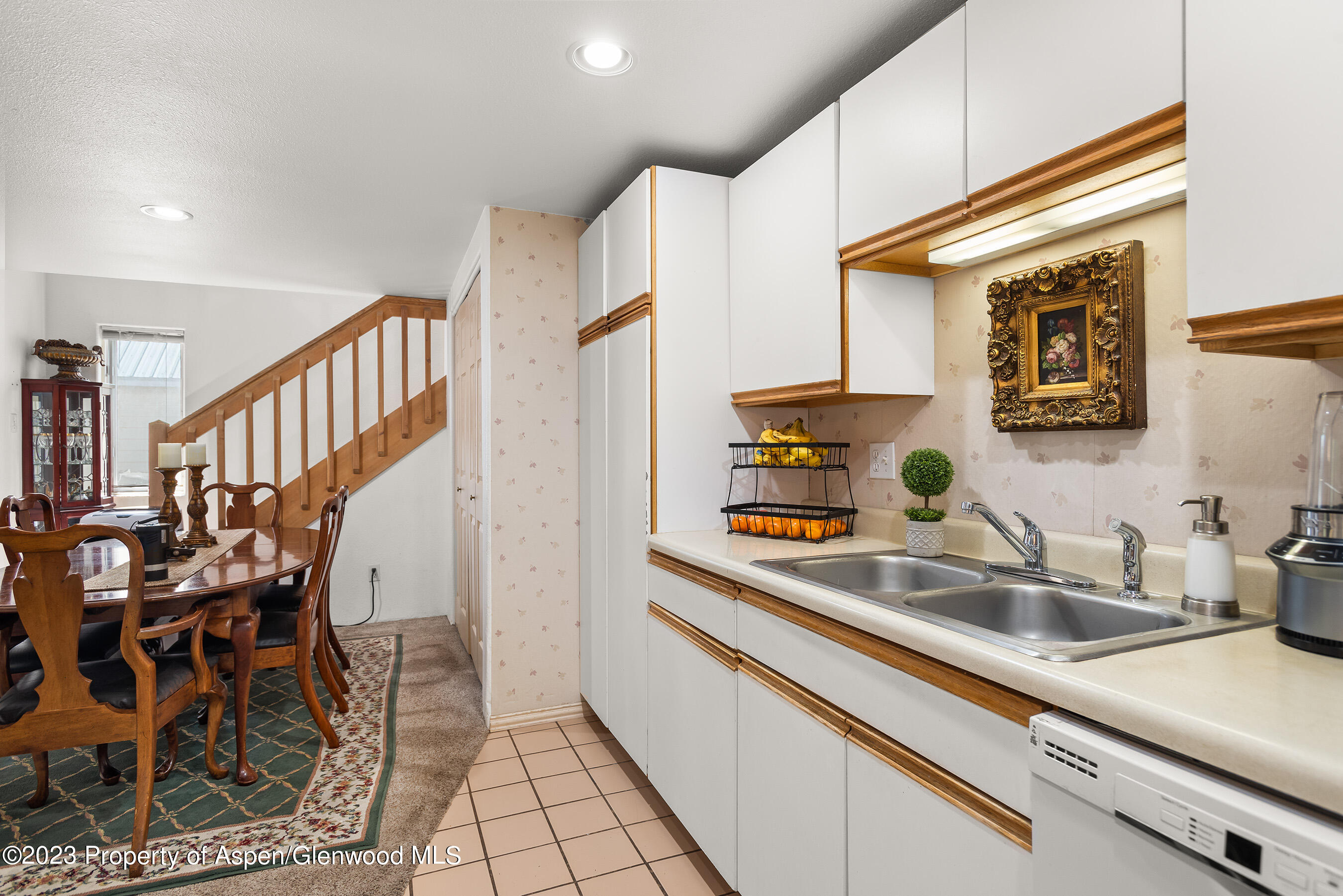 141-143 Swinging Bridge Lane Basalt, CO 81621 - Photo 22 of 35 a kitchen with stainless steel appliances granite countertop a sink and cabinets