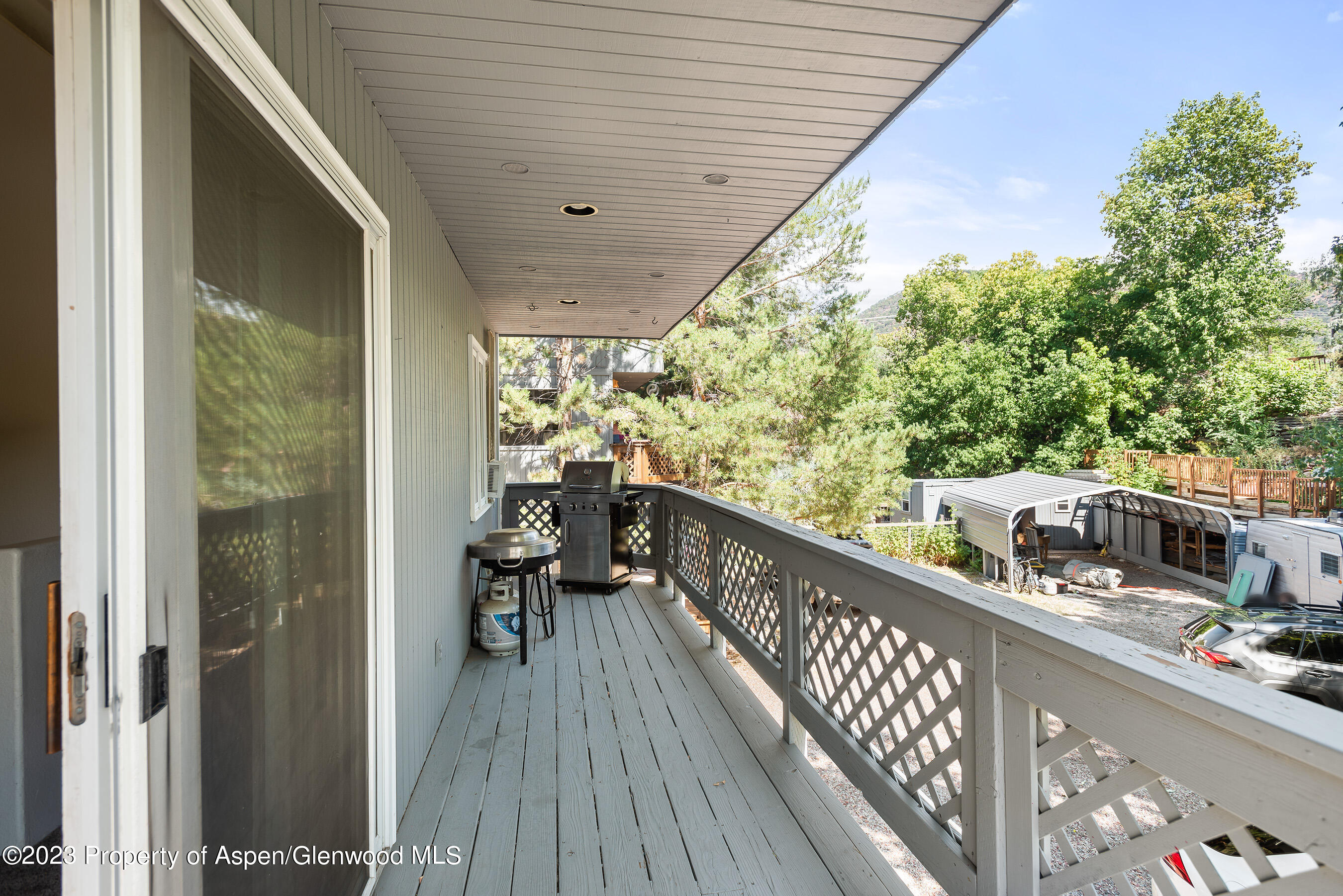 141-143 Swinging Bridge Lane Basalt, CO 81621 - Photo 24 of 35 a balcony with wooden floor and furniture