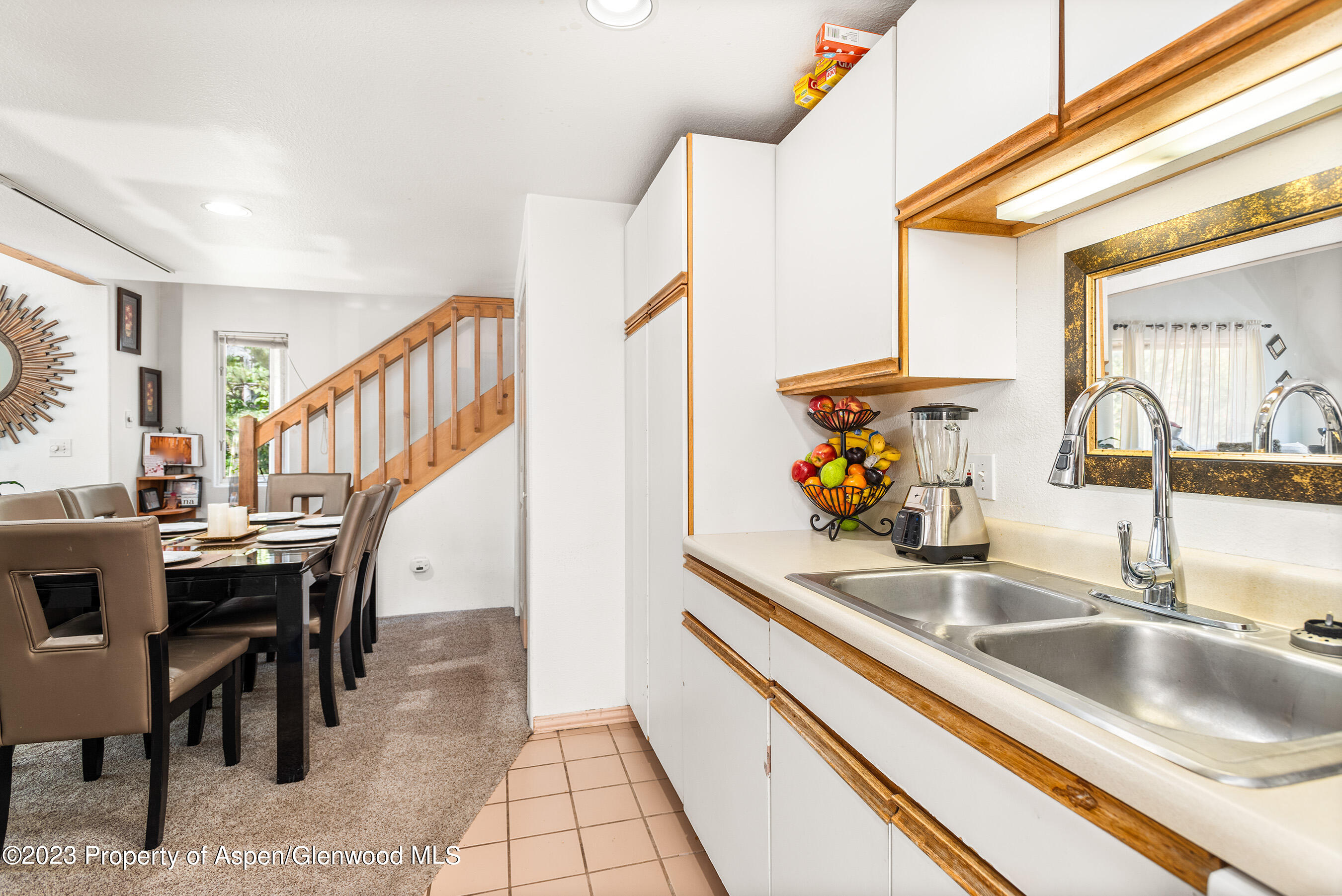 141-143 Swinging Bridge Lane Basalt, CO 81621 - Photo 6 of 35 a kitchen with stainless steel appliances kitchen island granite countertop a sink and a refrigerator