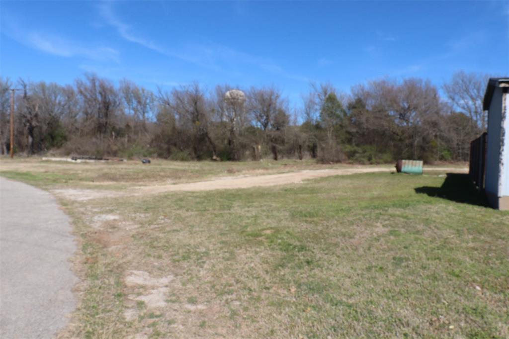 1616 Oliver Street Weatherford, TX 76086 - Photo 1 of 15 a view of dirt field with trees in background