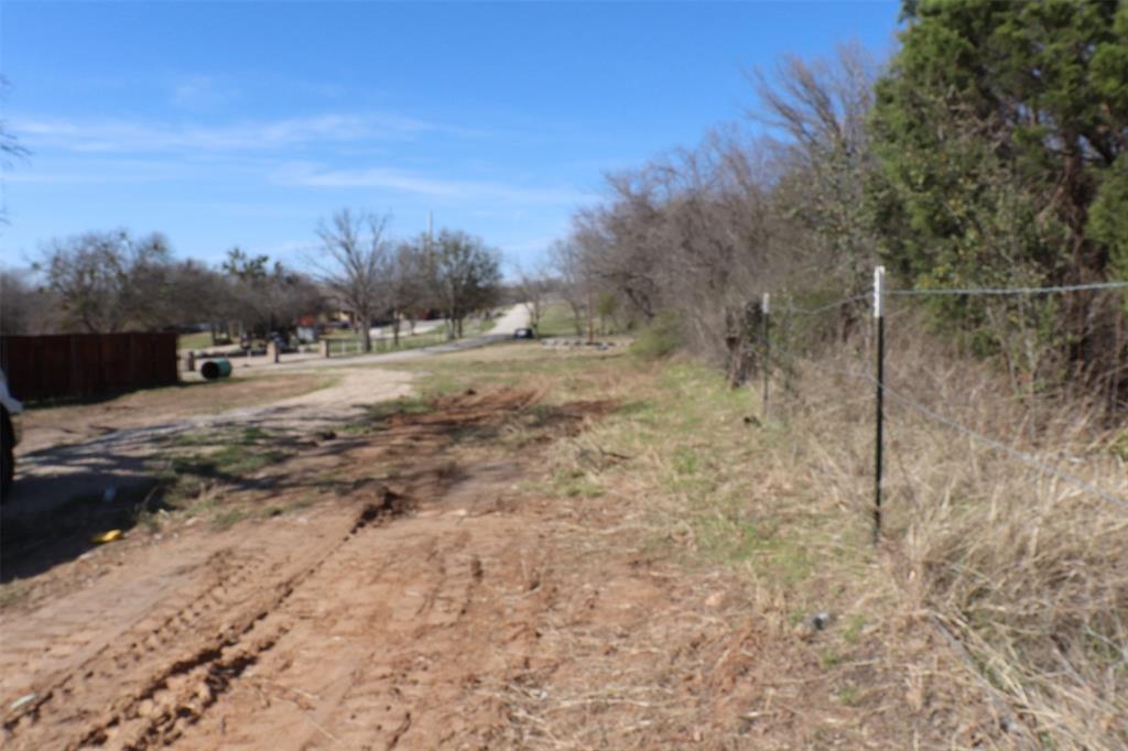 1616 Oliver Street Weatherford, TX 76086 - Photo 11 of 15 a view of a dry yard with trees
