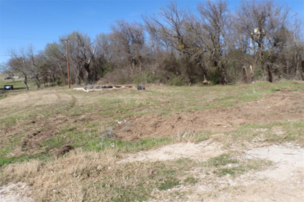 1616 Oliver Street Weatherford, TX 76086 - Photo 4 of 15 a view of dirt field with trees in the background