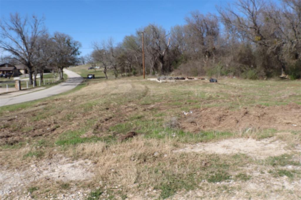 1616 Oliver Street Weatherford, TX 76086 - Photo 9 of 15 a view of dirt yard with a trees