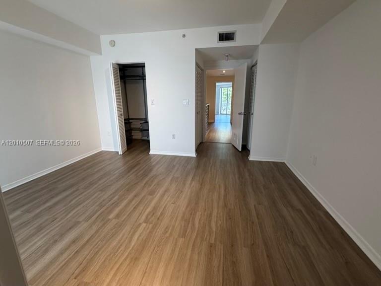 1712 Southwest 2nd Avenue, Unit 304 Miami, FL 33129 - Photo 11 of 18 a view of a room with wooden floor and stairs