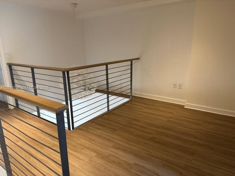 1712 Southwest 2nd Avenue, Unit 304 Miami, FL 33129 - Photo 6 of 18 a view of a room with wooden floor