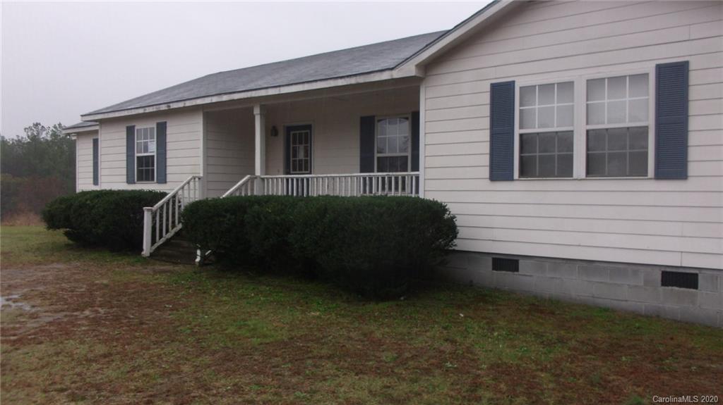 336 Landfill Road Jefferson, SC 29718 - Photo 1 of 9 front view of a house with a yard