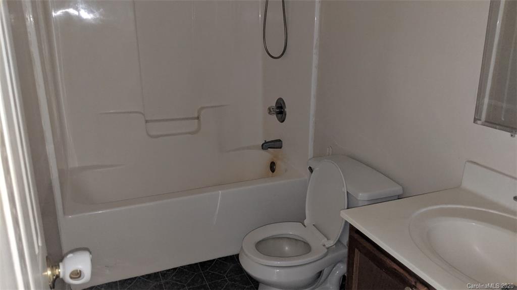 336 Landfill Road Jefferson, SC 29718 - Photo 4 of 9 a bathroom with a sink a toilet and shower