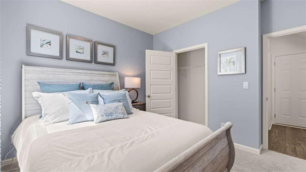 476 Bullock Pass Jefferson, GA 30549 - Photo 23 of 66 a bedroom with a bed and painting on the wall