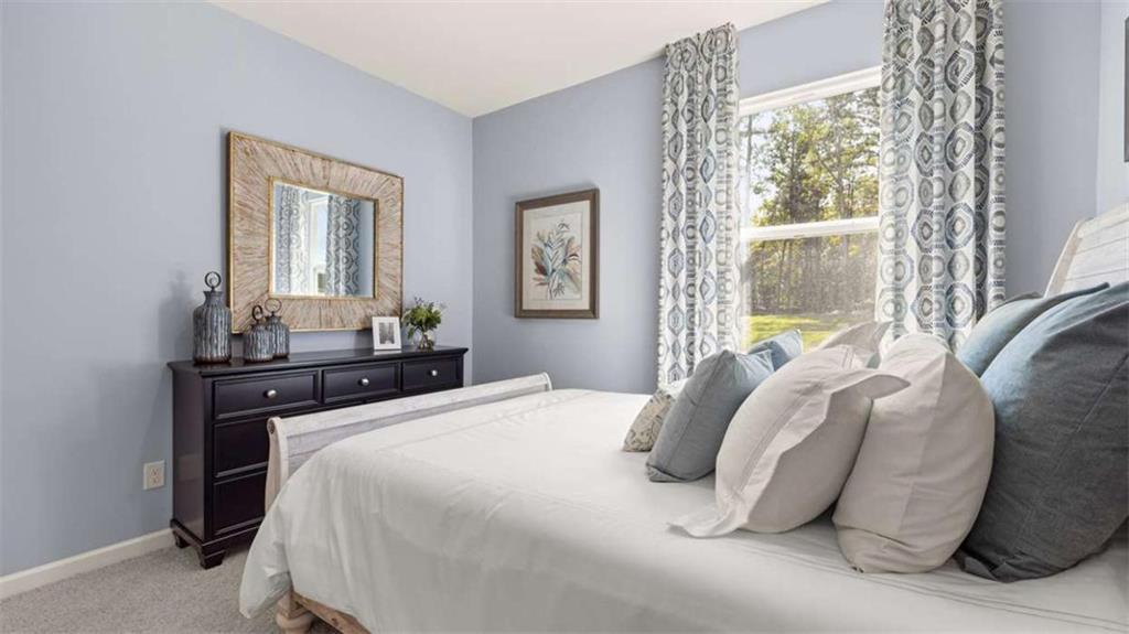 476 Bullock Pass Jefferson, GA 30549 - Photo 24 of 66 a bedroom with a bed and wooden floor