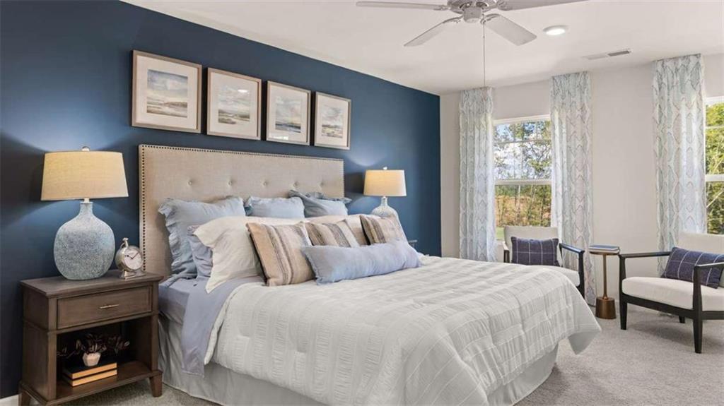476 Bullock Pass Jefferson, GA 30549 - Photo 29 of 66 a bedroom with a bed a mirror and a window