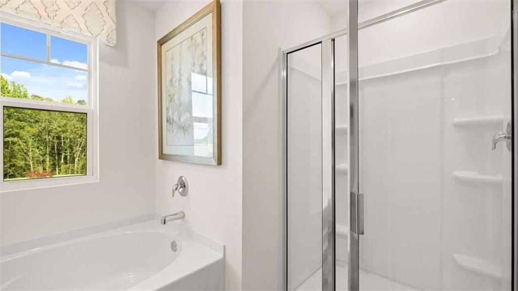 476 Bullock Pass Jefferson, GA 30549 - Photo 34 of 66 a white bath tub sitting next to a window