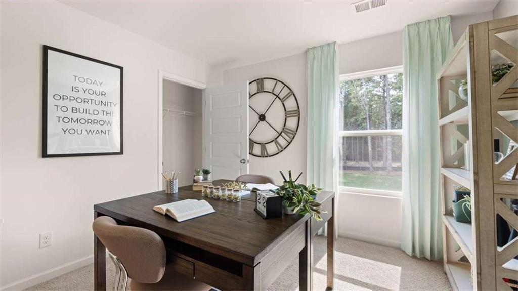476 Bullock Pass Jefferson, GA 30549 - Photo 51 of 66 a view of a dining room with furniture window and wooden floor