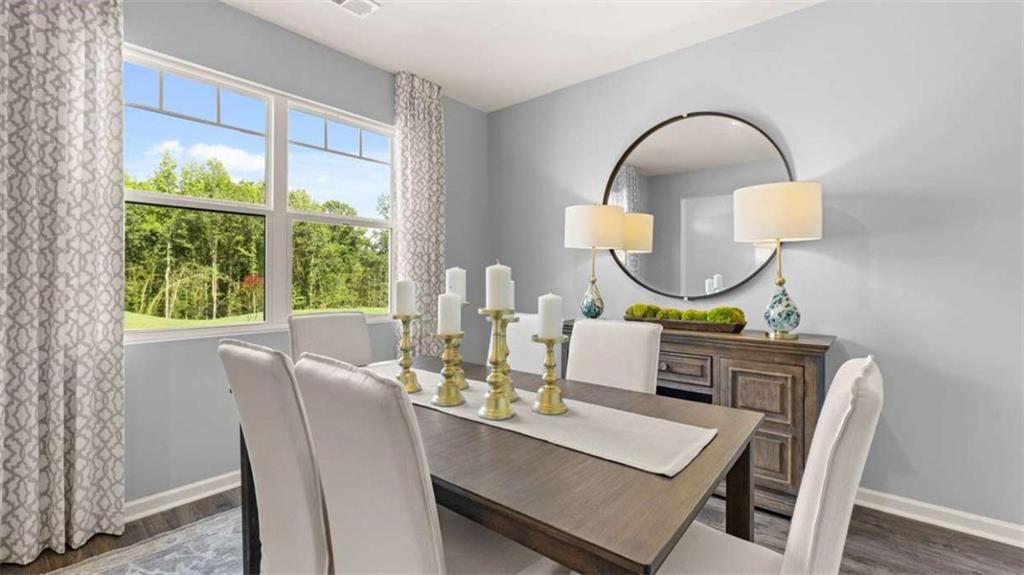 476 Bullock Pass Jefferson, GA 30549 - Photo 6 of 66 a dining room with furniture and a mirror