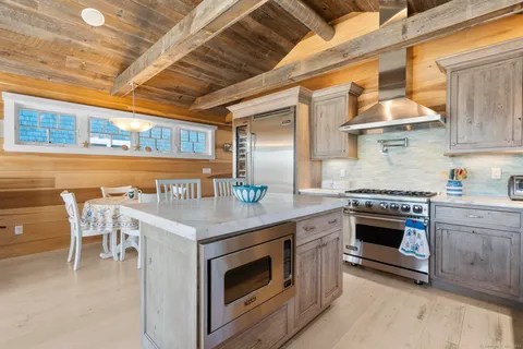 a kitchen with a stove and a sink