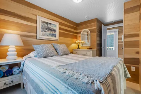 a bedroom with a bed and a cabinets