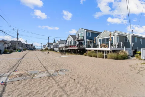 a view of multiple houses with a street