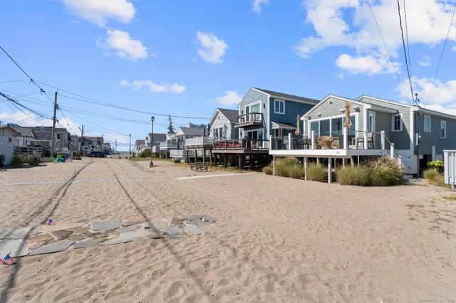 a view of multiple houses with a street
