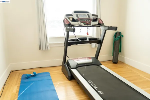 a view of a room with wooden floor and bathroom