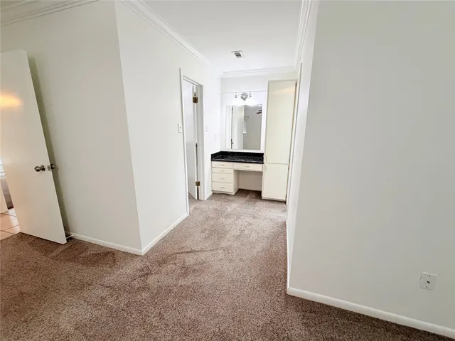 a view of a storage & utility room with a sink