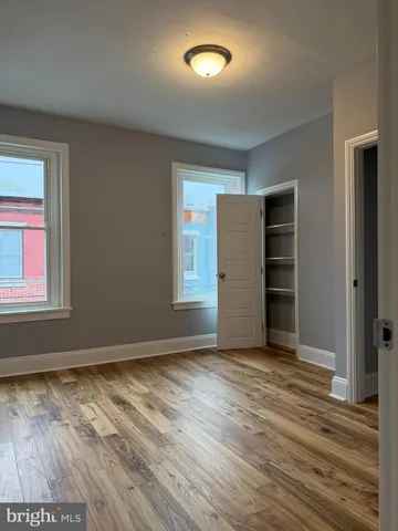 a view of a livingroom with wooden floor