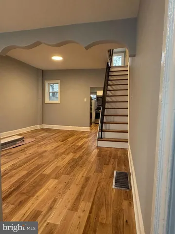 a view of a livingroom with wooden floor