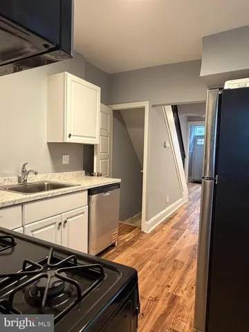 a kitchen with a stove and a microwave