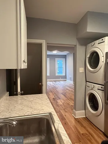 a kitchen with granite countertop a stove and a sink