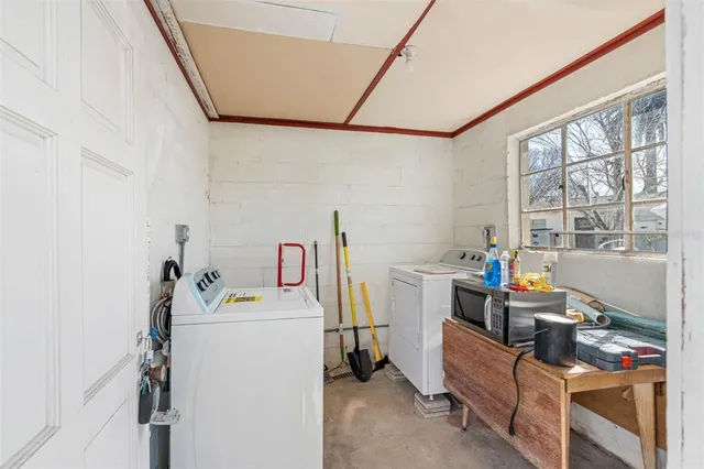 an aerial view of a swimming pool with outdoor seating