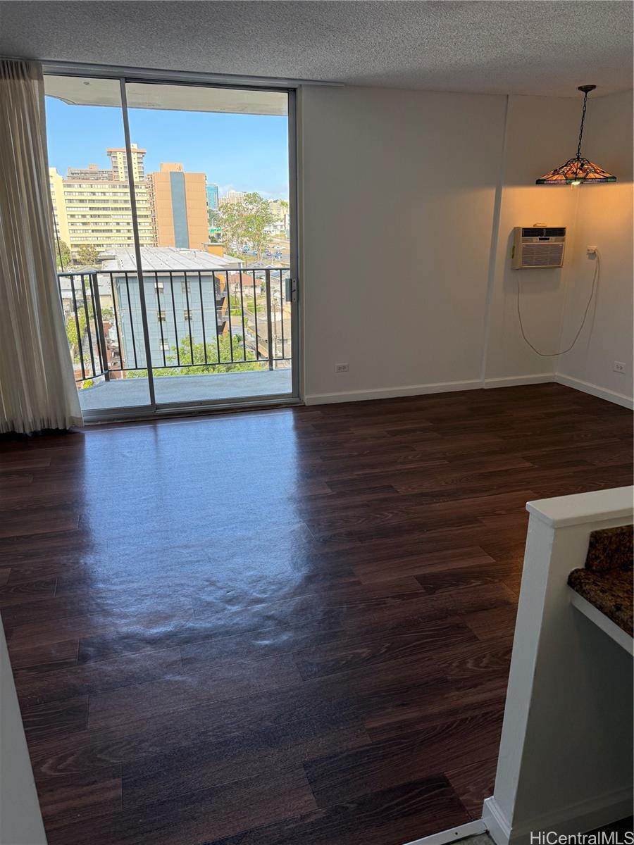 1112 Kinau Street, Unit 807 Honolulu, HI 96814 - Photo 5 of 10 a view of a room with wooden floor