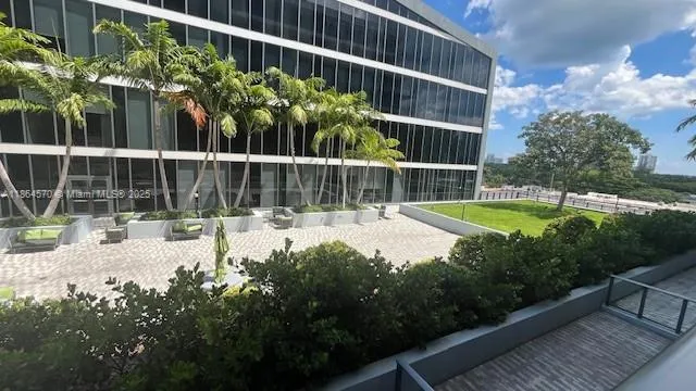 a view of a garden with a small pool