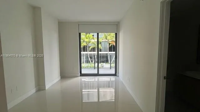 a view of empty room with front door