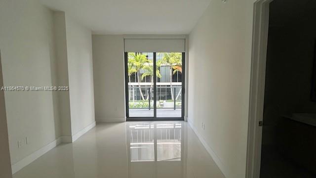 2960 Northeast 207th Street, Unit 607 Aventura, FL 33180 - Photo 3 of 11 a view of empty room with front door