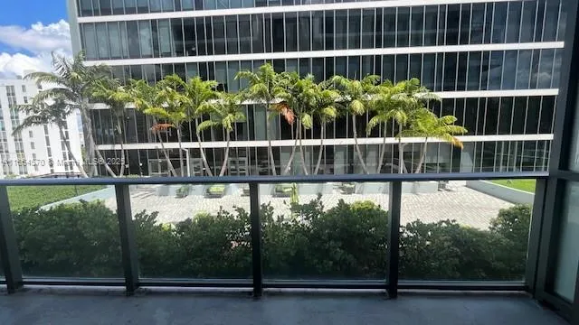 a view of a balcony with a plant