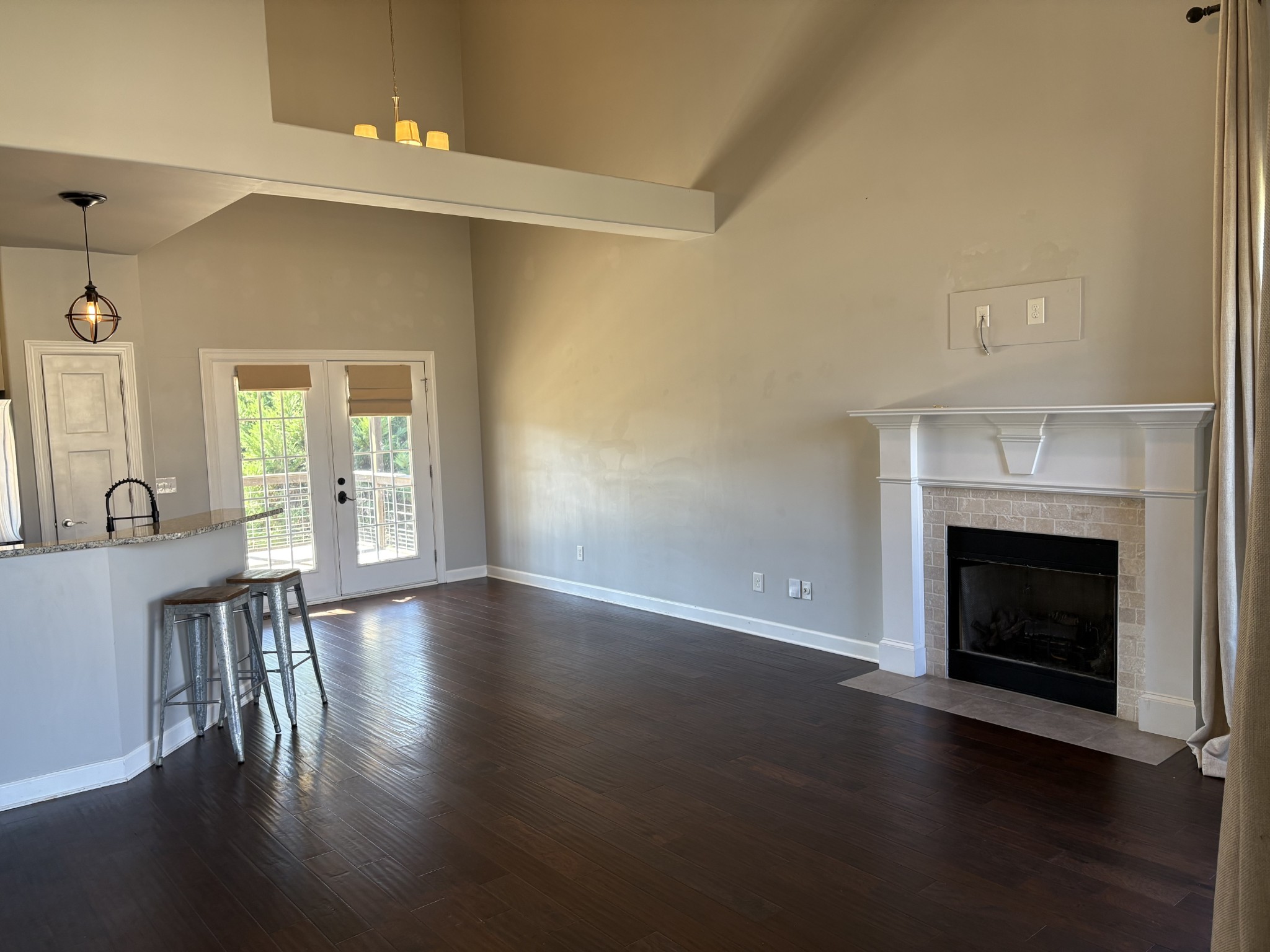 1073 Golf View Way Spring Hill, TN 37174 - Photo 3 of 12 a view of an empty room with wooden floor and a fireplace