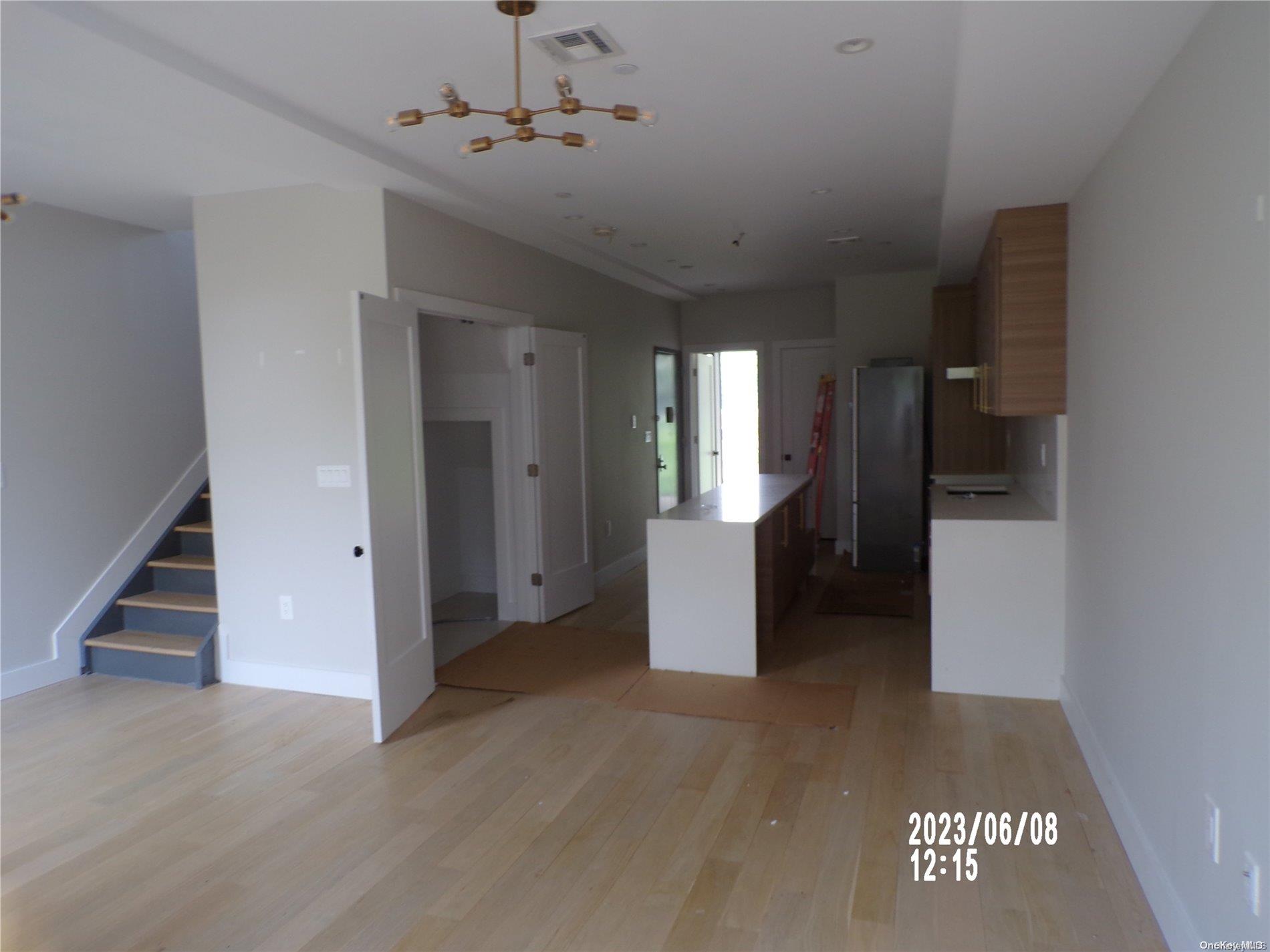 695 Monroe Street Brooklyn, NY 11221 - Photo 15 of 23 a view of a kitchen with a sink and a refrigerator